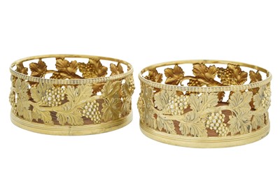 Lot 376 - A pair of George III sterling silver gilt wine coasters, Sheffield 1818 by James and Thomas Settle