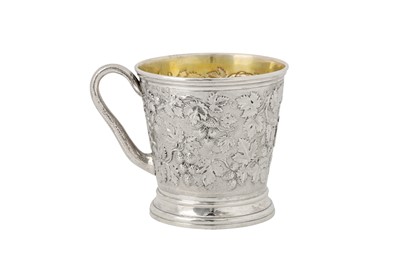 Lot 332 - A Victorian sterling silver ‘fruiting vine’ mug, London 1850 by John Samuel Hunt