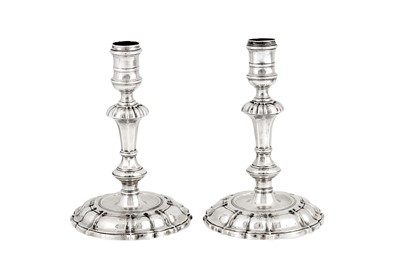 Lot 463 - A pair of George II sterling silver cast candlesticks, London 1743 by Thomas Gilpin (reg. 24th Sep 1730)