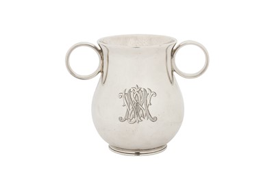 Lot 295 - A Victorian sterling silver 'Ox Eye' or college twin handled cup, London 1863 by George John Richards and Edward Charles Brown