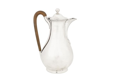 Lot 430 - A George III sterling silver hot water pot, London 1788 by John Scofield (reg. 13th Jan 1778)