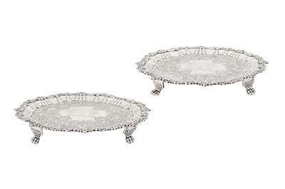 Lot 405 - Hallmarking interest – A pair of George III Irish sterling silver salvers, Dublin 1818 by SB and IM, possibly for Simon Bergin and J Mahoney