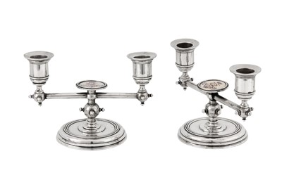 Lot 185 - A pair of Alexander III late 19th century Russian 84 zolotnik silver and enamel twin candlesticks, Saint Petersburg circa 1886 by Friedrich Emil Henrichsen
