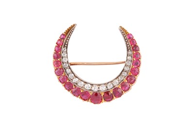 Lot 161 - A DIAMOND AND RUBY CRESCENT BROOCH