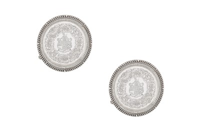 Lot 348 - An assembled pair of George III / Victorian sterling silver salvers, one London 1815 by Richard Sibley I, the other London 1874 by Francis Boone Thomas