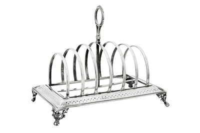 Lot 333 - A Victorian sterling silver seven bar toast rack, London 1874 by Henry Holland