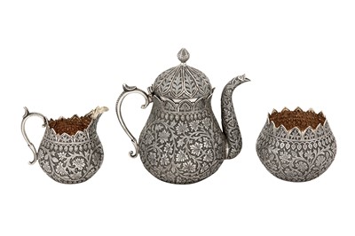 Lot 100 - A late 19th century Anglo - Indian silver three-piece tea service on tray, Kashmir circa 1890