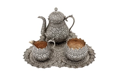 Lot 100 - A late 19th century Anglo - Indian silver three-piece tea service on tray, Kashmir circa 1890