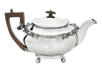 Lot 403 - A George III Irish sterling silver teapot, Dublin 1818 by William Nolan, retailed by William Law