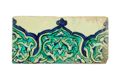 Lot 302 - AN OTTOMAN DAMASCUS BORDER POTTERY TILE WITH RUMI MOTIF