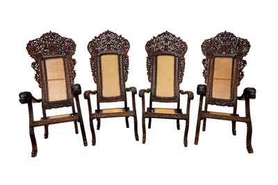 Lot 510 - TWO PAIRS OF INDO-PORTUGUESE CARVED HARDWOOD PLANTATION ARMCHAIRS