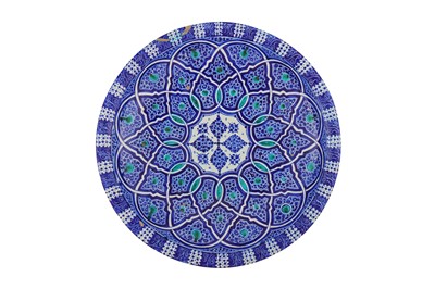 Lot 254 - A MOROCCAN BLUE AND TURQUOISE-PAINTED POTTERY CHARGER