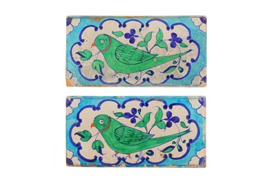 Lot 436 - A PAIR OF MULTAN POTTERY TILES WITH GREEN PARAKEET