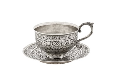 Lot 447 - A LATE 19TH CENTURY ANGLO-INDIAN UNMARKED SILVER TEA CUP AND SAUCER