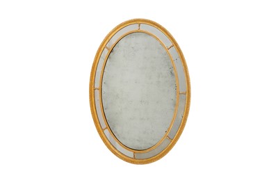 Lot 442 - A GEORGE III OVAL GILT WALL MIRROR
