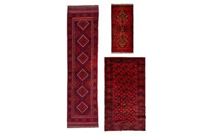 Lot 325 - AN AFGHAN RUNNER, RUG AND BOKHARA DESIGN RUG