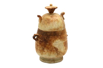 Lot 207 - A CHINESE HARDSTONE ARCHAISTIC VASE AND COVER, 20TH CENTURY