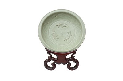 Lot 854 - A CHINESE CELADON-GLAZED 'FISH' DISH