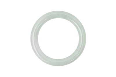 Lot 623 - A CHINESE PALE GREEN JADE BANGLE