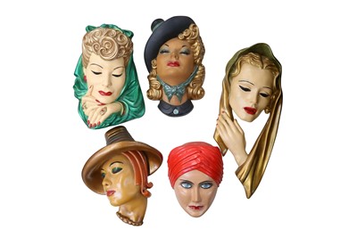 Lot 168 - A GROUP OF PAINTED PLASTER WALL HANGING MASKS