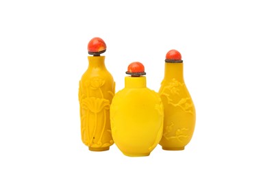 Lot 891 - THREE YELLOW BEIJING GLASS SNUFF BOTTLES