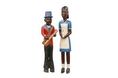 Lot 263 - TWO WEST AFRICAN CARVED AND PAINTED COLON SCULPTURES
