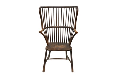 Lot 519 - AN EARLY 20TH CENTURY STAINED BEECH AND ASH WING BACK WINDSOR ARMCHAIR