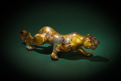 Lot 92 - A CHINESE GILT-BRONZE 'FELINE' FIGURE