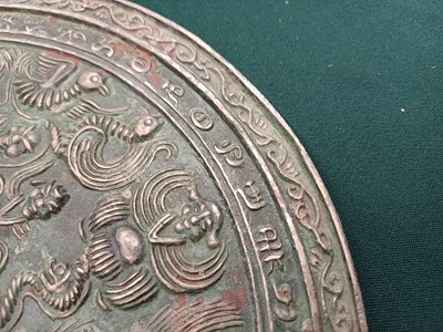 Lot 486 - A CHINESE BRONZE 'IMMORTALS' MIRROR