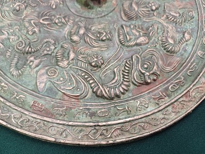 Lot 486 - A CHINESE BRONZE 'IMMORTALS' MIRROR