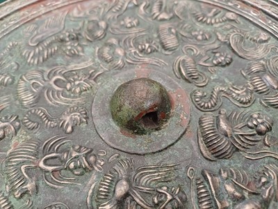 Lot 486 - A CHINESE BRONZE 'IMMORTALS' MIRROR