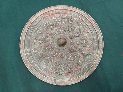 Lot 486 - A CHINESE BRONZE 'IMMORTALS' MIRROR