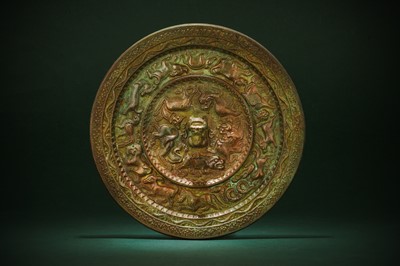 Lot 489 - A CHINESE BRONZE 'ZODIAC' MIRROR