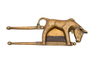 Lot 117 - AN ENGRAVED BRASS BETEL NUT CUTTER WITH A HOLY COW