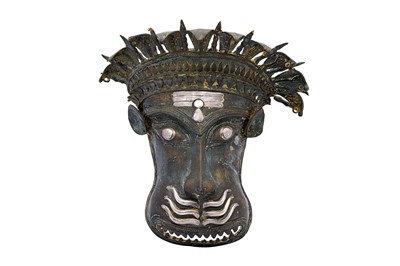 Lot 144 - A LARGE SILVER-INLAID BRONZE SHAIVA CEREMONIAL BUTA MASK