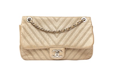 Lot 92 - Chanel Metallic Gold Chevron Stud Wars Flap Bag