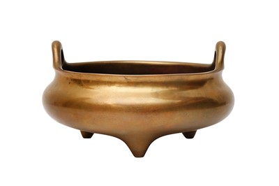 Lot 50 - A CHINESE POLISHED BRONZE TRIPOD CENSER
