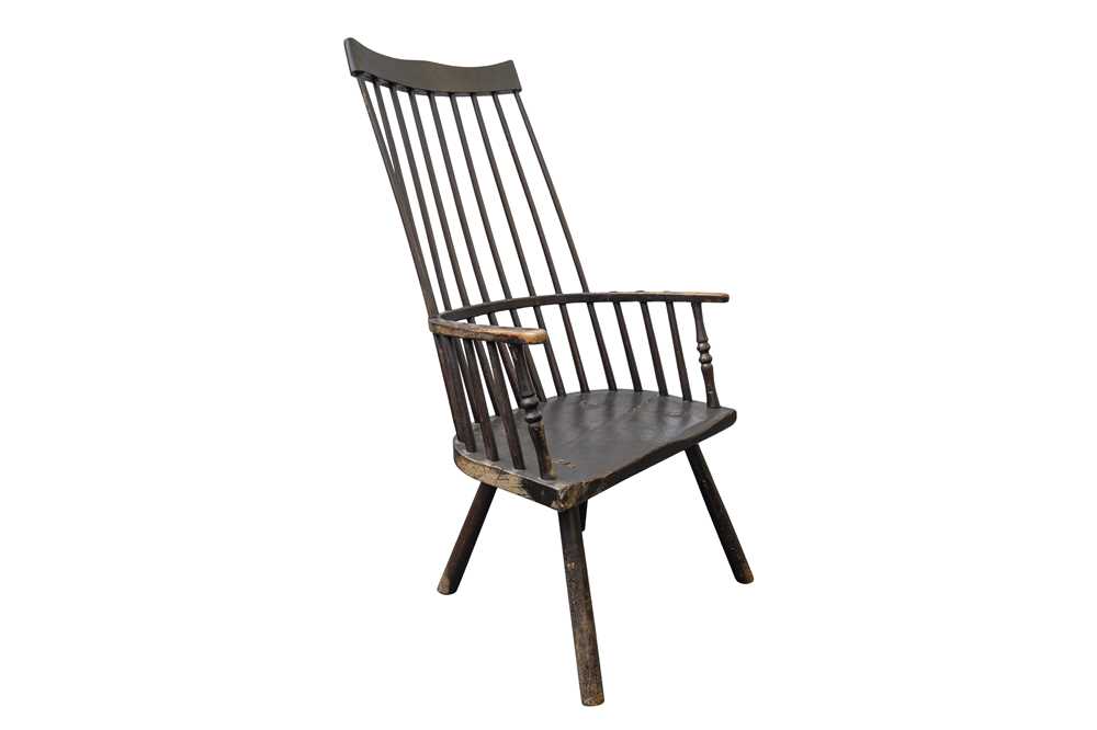 Lot 91 - AN 18TH CENTURY AND LATER EBONISED ASH AND ELM COMB BACK PROVINCIAL ARMCHAIR