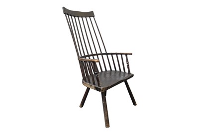 Lot 91 - AN 18TH CENTURY AND LATER EBONISED ASH AND ELM COMB BACK PROVINCIAL ARMCHAIR