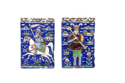 Lot 295 - TWO QAJAR POLYCHROME-PAINTED AND MOULDED POTTERY TILES