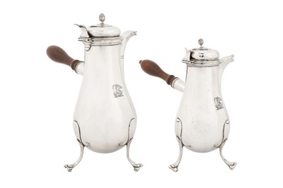 Lot 211 - A graduated pair of late 18th century French provincial silver chocolate pots, Strasbourg circa 1785 by Jacques-Henri Alberti (reg. 1764)