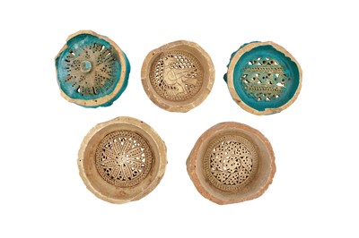 Lot 410 - FIVE PIERCED EARTHENWARE WATER JUG FILTERS