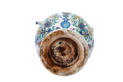 Lot 405 - AN IZNIK-STYLE POLYCHROME-PAINTED SAMSON POTTERY SPOUTED EWER