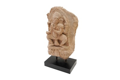 Lot 3 - A SMALL CARVED SANDSTONE STELE WITH FOUR-ARMED GANESHA