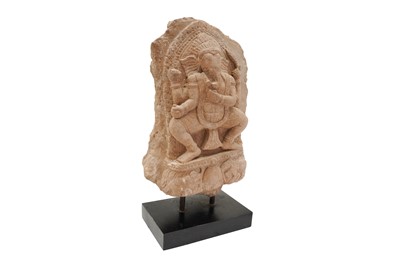 Lot 3 - A SMALL CARVED SANDSTONE STELE WITH FOUR-ARMED GANESHA