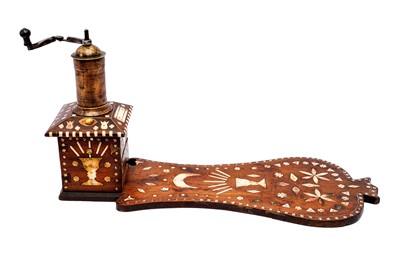 Lot 431 - A CARVED HARDWOOD BONE-INLAID ARABIC COFFEE GRINDER