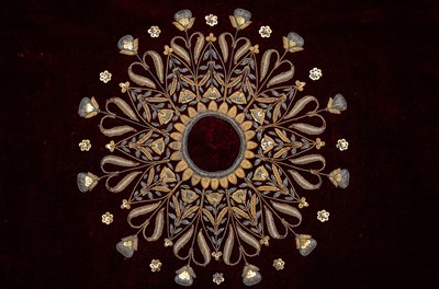 Lot 257 - A PLUM VELVET COVER WITH PEACOCKS