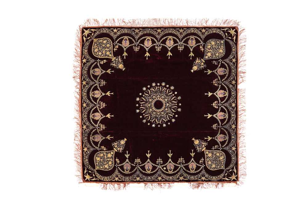 Lot 257 - A PLUM VELVET COVER WITH PEACOCKS