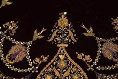 Lot 257 - A PLUM VELVET COVER WITH PEACOCKS