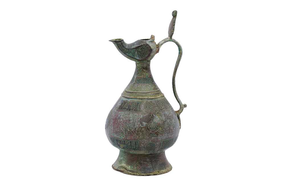 Lot 347 - AN ENGRAVED BRONZE EWER